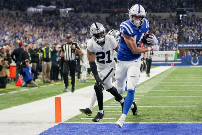 Indianapolis Colts wide receiver Alec Pierce (14) runs into the end zone for a touchdown as Las Vegas Raiders cornerback Amik Robertson (21) gives chase Sunday, Dec. 31, 2023, during a game against the Las Vegas Raiders at Lucas Oil Stadium in Indianapolis.